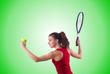 Woman playing tennis against the gradient