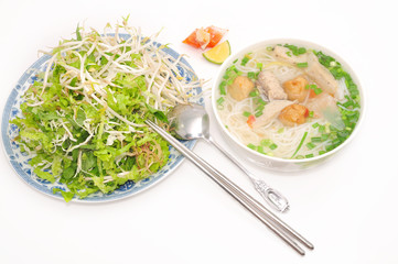 Bun cha ca or Vietnamese rice vermicelli with grilled fish and herbs on a white background