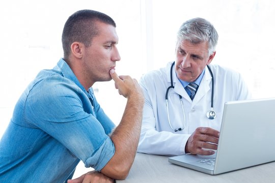 Worried patient with his doctor 