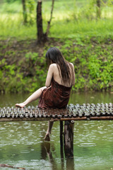 asian woman taking bath outdoor