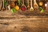 Colorful spices on wooden table