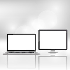 Laptop and flat monitor with blank screen isolated