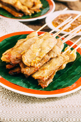 Pork Satay with delicious peanut sauce, one of famous local dishes.