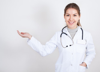 smiling nurse shows the way