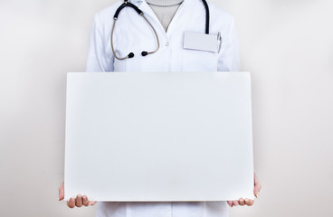 nurse holding a banner for advertising © maksimvasic1993
