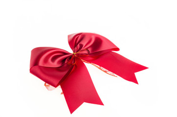 Red satin gift bow. Ribbon. Isolated on white