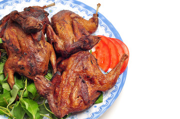 Vietnamese grilled quail on a white background