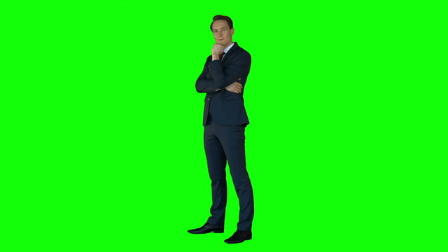 Businessman thinking on green screen 