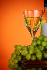 glass of wine and grape bunch
