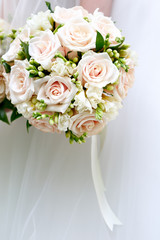 The bride at a wedding holding a bouquet of flowers.