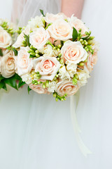 The bride at a wedding holding a bouquet of flowers.