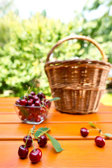 Fototapeta na wymiar red cherry and hand basket