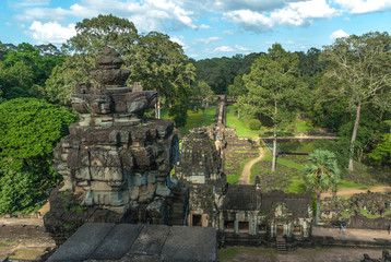 Fototapeta na wymiar sight of the gopura of the exterior enclosure, of the roadway and the ponds of the baphuon in the archaeological angkor thom place in siam reap, cambodia