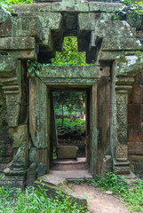 door with bas-reliefs of the royal palace in the archaeological angkor thom place in siam reap cambodia