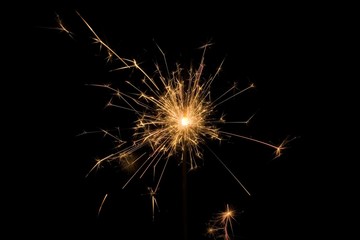 Detail view of a sparkler at night