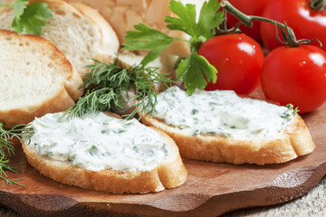 Bruschetta with white sauce and herbs, selective focus