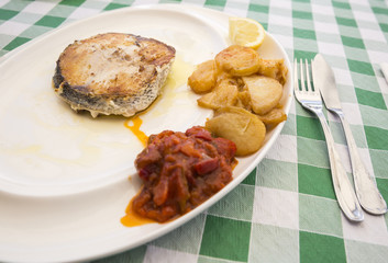fish and potatoes cooked in the oven