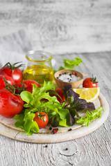 ingredients for a fresh salad with tomatoes and garden herbs 