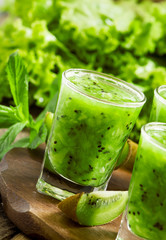 Fresh green smoothie with kiwi, cucumber, selective focus