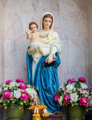 Mary statue standing.