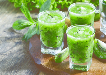 Fresh green smoothie with kiwi, cucumber, selective focus