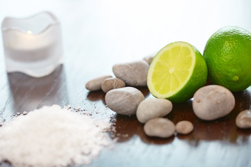Spa Background. Sea Salt with Lime Stones and Candle . Body scru