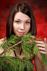beautiful girl with pine branch