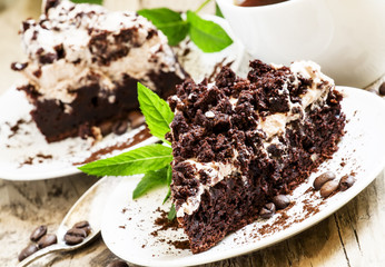 Chocolate and coffee cake with butter cream, selective focus