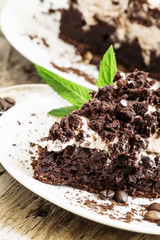 Chocolate and coffee cake with butter cream, selective focus