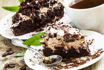 Chocolate and coffee cake with butter cream, selective focus