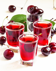 Fresh cherry juice with berries, selective focus