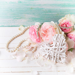 Decorative heart and fresh pink roses