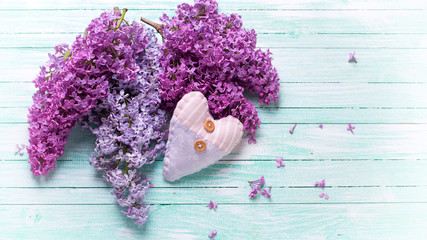 Background with  lilac flowers and decorative heart