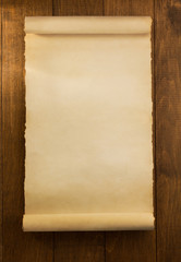 parchment scroll on wood