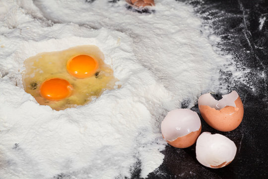 two eggs in flour