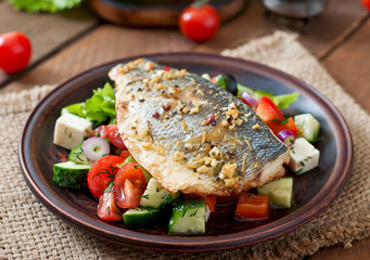 Baked seabass with Greek salad. 
