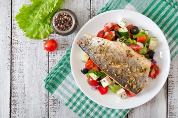 Baked seabass with Greek salad. 