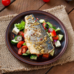 Baked seabass with Greek salad. 