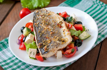 Baked seabass with Greek salad. 