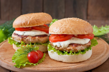 Appetizing hamburger with chicken burger and sauce Tartar