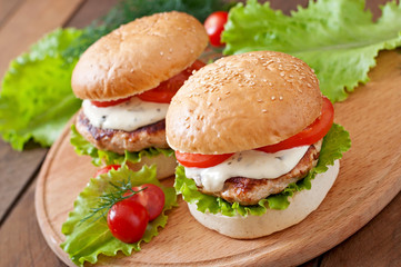 Appetizing hamburger with chicken burger and sauce Tartar