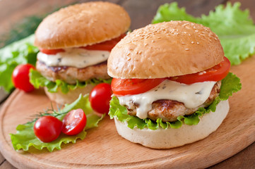 Appetizing hamburger with chicken burger and sauce Tartar