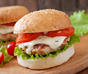 Appetizing hamburger with chicken burger and sauce Tartar