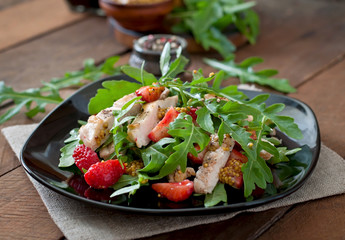 Chicken salad with arugula and strawberries