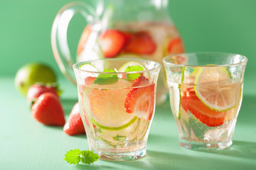 refreshing summer drink with strawberry cucumber lime in jar and