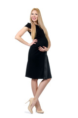 Fototapeta premium Pretty pregnant woman in black dress isolated on white