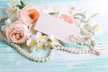 Roses, jasmine flowers and empty tag