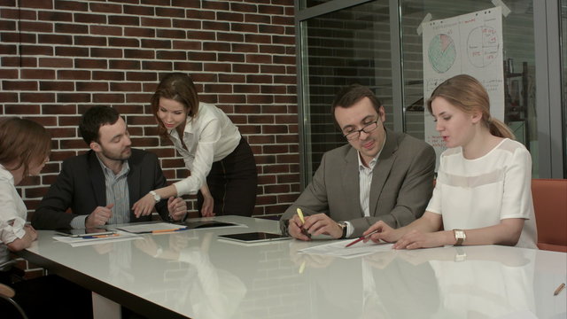 Group of business people brainstorming together in the meeting