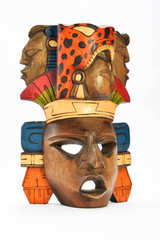 Indian Mayan Aztec wooden painted mask with roaring jaguar and human profiles isolated on white background (right angle take) © breakingthewalls