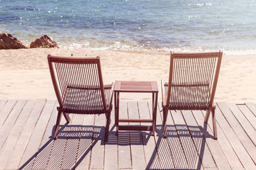 Two sitting place and table in a tropical beach